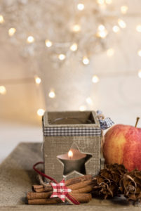 Christmas Still Life with tea light holder, apples, cinnamon and cones sorts Christmas decorations, Christmas Still Life with tea light holder, apples, cinnamon and cones sorts Christmas decorations,