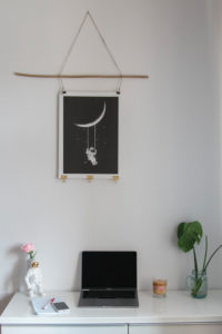 Home office desk with smartphone and decorative astronaut Home office desk with smartphone and decorative astronaut
