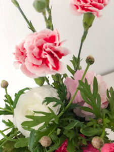 Spring bouquet with carnations and ranunculus, colorful bouquet in a white vase, Instagram style, Spring bouquet with carnations and ranunculus, colorful bouquet in a white vase, Instagram style,