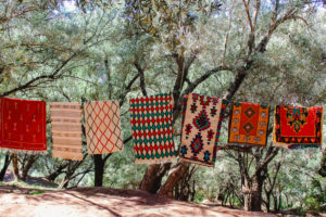 Berber carpets in Morocco in Ouzoud on hanging line Berber carpets in Morocco in Ouzoud on hanging line
