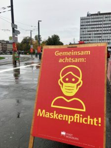Warning sign mask compulsory on Bahnhofsplatz in Würzburg Warning sign mask compulsory on Bahnhofsplatz in Würzburg
