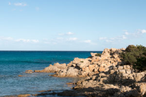 Rocks, cliffs, bay near Orosei in Sardinia with pine trees and blue sea Rocks, cliffs, bay near Orosei in Sardinia with pine trees and blue sea