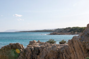 Rocks, cliffs, bay near Orosei in Sardinia with pine trees and blue sea Rocks, cliffs, bay near Orosei in Sardinia with pine trees and blue sea