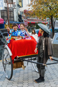 Japan, Honshu, Tokyo, Asakusa, Two Young Women Dressed in Kimono Riding in Rickshaw Japan, Honshu, Tokyo, Asakusa, Two Young Women Dressed in Kimono Riding in Rickshaw