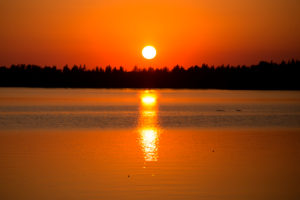 Beautiful sunset reflecting on the lake surface, Finland Beautiful sunset reflecting on the lake surface, Finland