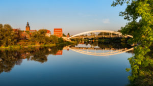 Havelberg with St. Laurentius Church and Havel Bridge in the evening light, reflection in the Havel River, Hanseatic City of Havelberg, Saxony-Anhalt, Germany