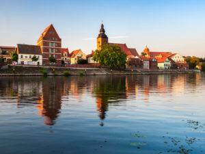 Havelberg with St. Marien Cathedral in the evening light, reflection in the Havel River, Hanseatic City of Havelberg, Saxony-Anhalt, Germany