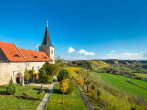 View into the Unstruttal with the monastery church Zscheiplitz in autumn with a view to Freyburg, Saxony-Anhalt, Germany