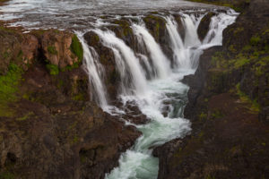The Kolufossar waterfalls of the river Vididalsa consists of 3 falls the upper fall Efrifoss, in the middle Kolufoss and the lower fall Nedri-Kolufoss. Located in NW Iceland. The Kolufossar waterfalls of the river Vididalsa consists of 3 falls the upper fall Efrifoss, in the middle Kolufoss and the lower fall Nedri-Kolufoss. Located in NW Iceland.
