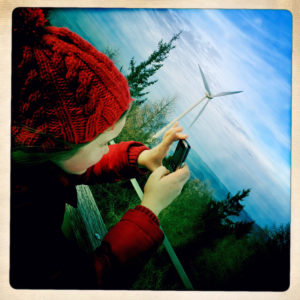 Daughter photographing with her ??mobile phone on the Rosskopf in the Black Forest near Freiburg im Breisgau, Baden-Wuerttemberg