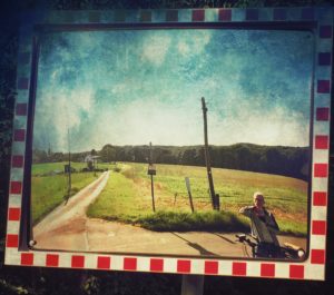 Man with bike reflected in mirror