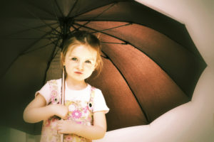 Girl holding umbrella