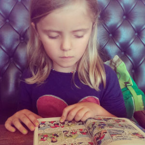 Girl reading comic strip