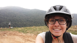 Woman with cycling helmet doing a selfie