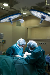 Surgeons and nurse during a foot surgery