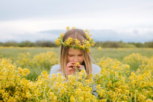 Portrait of girl with wreath of rape flowers Portrait of girl with wreath of rape flowers