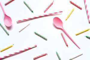 Studio shot of plastic spoons and birthday candles Studio shot of plastic spoons and birthday candles
