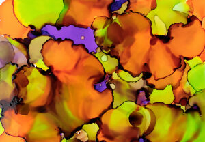 Bright colors blend together in an abstract alcohol ink art