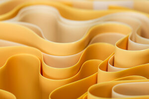 Abstract yellow waves and curves in a 3D design