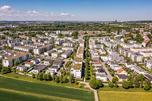 Aerial view of a modern housing development in Ludwigsburg, Germany, featuring photovoltaic systems and efficiency houses
