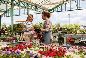 Customer and assistant interacting at garden center