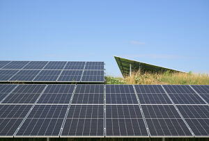 Solar panels on small hill in the Netherlands under blue sky