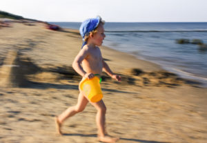 Usedom, boy runs with little bucket on the beach, Usedom, boy runs with little bucket on the beach,