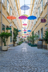 The Sünnhof-Passage with colorful umbrellas, passage and Biedermeier inner courtyard between Landstrasser Hauptstrasse and Ungargasse, 3rd district, Landstrasse, Vienna, Austria The Sünnhof-Passage with colorful umbrellas, passage and Biedermeier inner courtyard between Landstrasser Hauptstrasse and Ungargasse, 3rd district, Landstrasse, Vienna, Austria