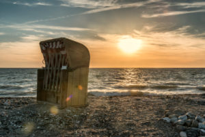 Wallnau, island of Fehmarn, Ostholstein, Schleswig-Holstein, Germany. Beach chairs on the beach of Wallnau in the evening light. Wallnau, island of Fehmarn, Ostholstein, Schleswig-Holstein, Germany. Beach chairs on the beach of Wallnau in the evening light.