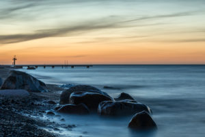 Marienleuchte, island of Fehmarn, Schleswig-Holstein, Germany, bathing jetty on the beach of Marienleuchte at dusk. Marienleuchte, island of Fehmarn, Schleswig-Holstein, Germany, bathing jetty on the beach of Marienleuchte at dusk.