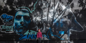 angry child in front of a graffiti, wolf, monkey, mural art, Spain, Europe, Santa Cruz, Tenerife angry child in front of a graffiti, wolf, monkey, mural art, Spain, Europe, Santa Cruz, Tenerife