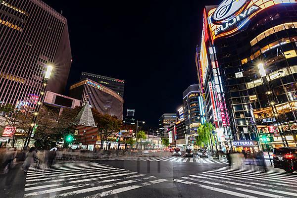 Tokyo, the Ginza. Foreground, people crossing on zebra crossing