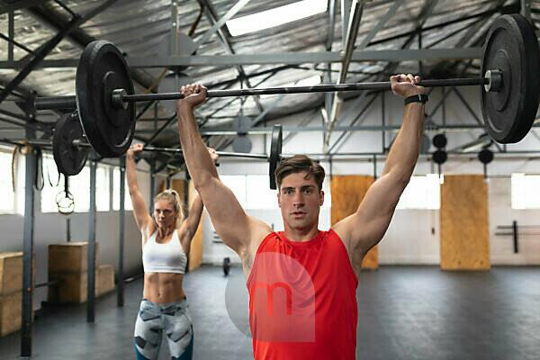 Group Of Eight Happy Muscular Female And Male Adults Standing Together As  Good Friends In Gym With Large Speaker In Background After A Difficult  Workout Session Stock Photo, Picture and Royalty Free