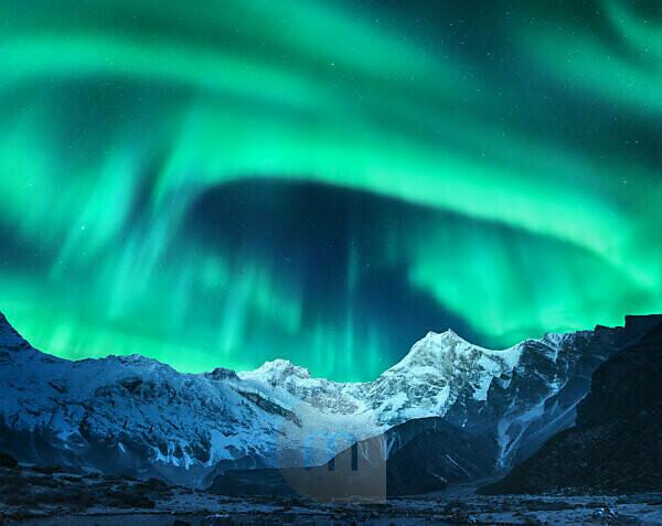 Bildagentur Mauritius Images Aurora Borealis Above The Snow Covered Mountain Peak In Norway Northern Lights In Winter Night Landscape With Green Polar Lights And Snowy Mountains Starry Sky With Aurora