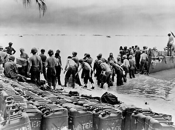 Bildagentur mauritius images Bucket Brigade These Marines line