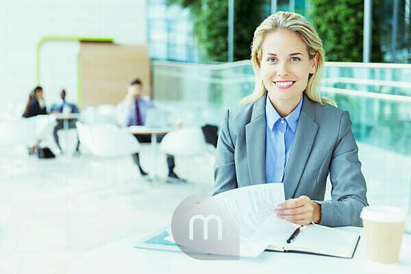 Young plus size businesswoman smiling happy holding binder in the