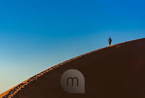 Dune 45, orange sand and blue sky near … – License image