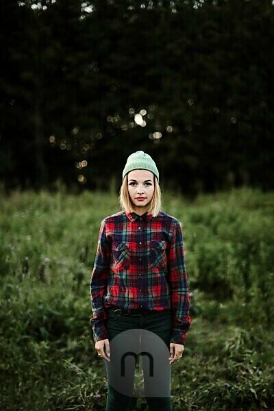 Young Beautiful Hipster Woman Standing On Field In The Countrysi