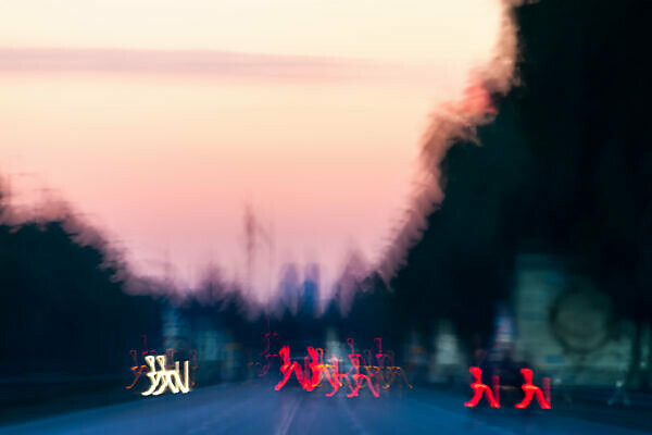 Conception - Lights cross a big street in the sundown,