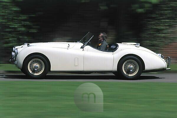 Bildagentur Mauritius Images Old Timer Sports Car Jaguar Xk Tread Makes Unfamiliar Outside White Preview Helped To Pull Motion Blur Car Passenger Car Cabriolet Country Road Convertible Hobby Motoring Hobby Leisure