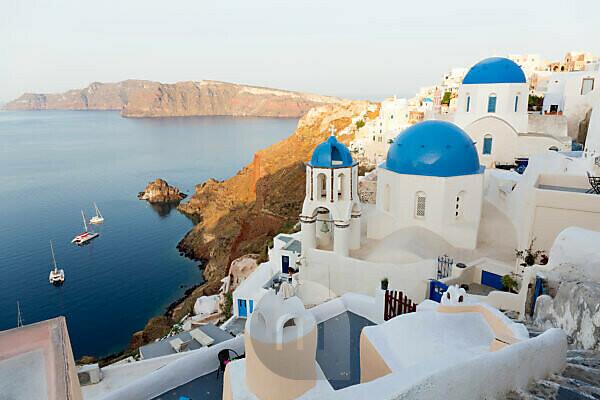 Traditional white buildings facing Mediterranean Sea in Oia