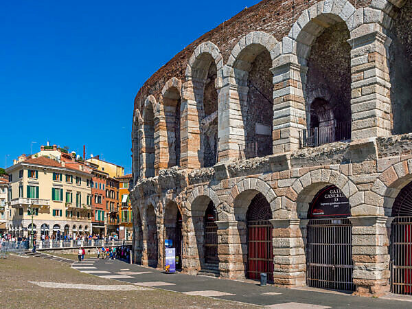 Roman amphitheatre Arena di Verona and Piazza Bra square at night