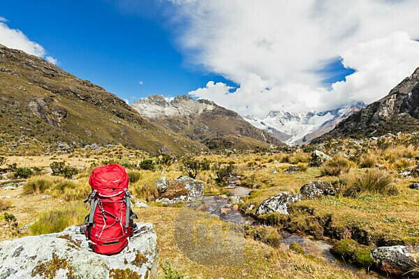 Woman hiker with backpack hiking in Cordillera Blanca, Peru, A