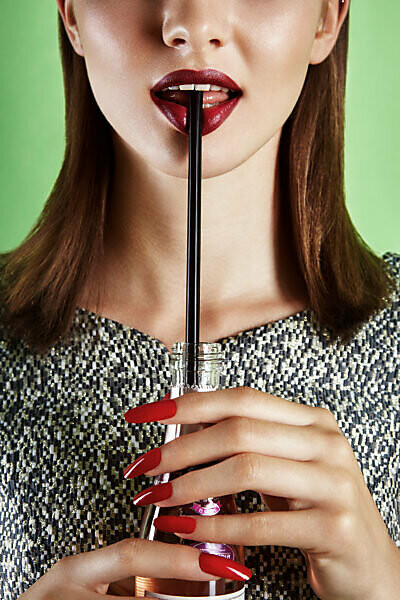 Summer Shooting, yung woman drinking with straw from a bottle Portrait, close-up, cropped