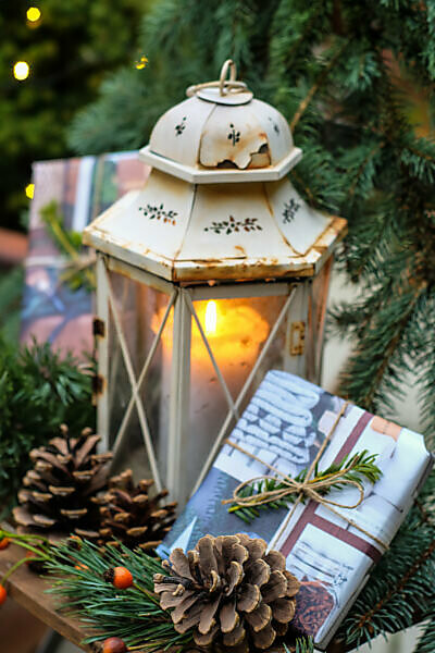 Christmassy still life with old lantern and presents - decoration garden, balcony, terrace