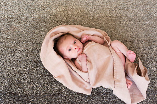 Baby wrapped 2024 in towel