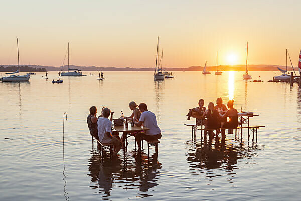 Tables in the water, sundowner bar in Übersee am Chiemsee, Chiemgau, Upper Bavaria, Bavaria, southern Germany, Germany, Europe