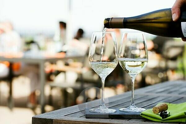 Glasses Of White Wine On Table by Foodcollection Rf