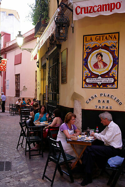 Bildagentur mauritius images People sitting at a tapas bar in