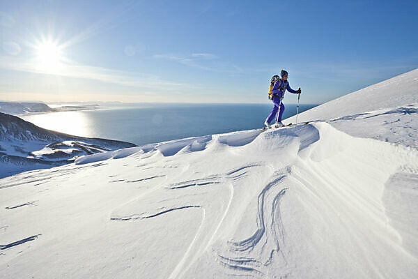 Mountaineer on ski tour in Akureyri, Fjord Eyjafjördur, Nordland, Iceland